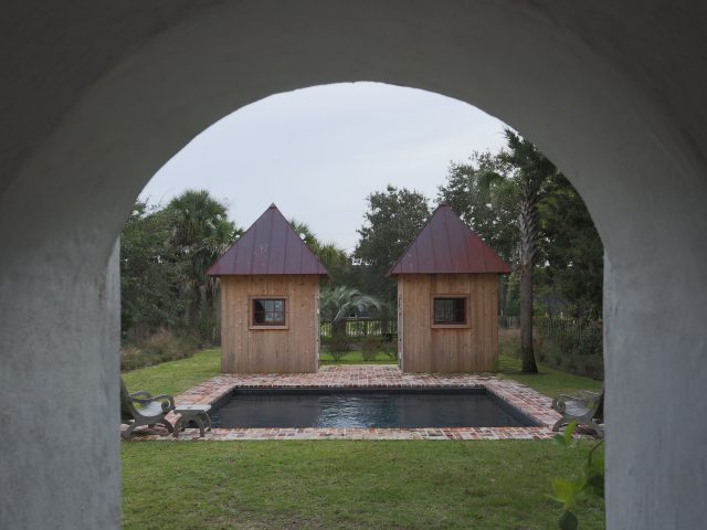 Geometric Inground Pool from arch view