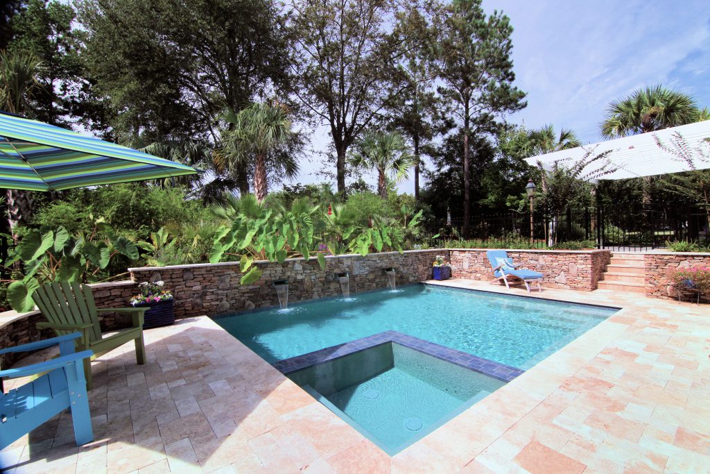 Inground pool with a brick deck
