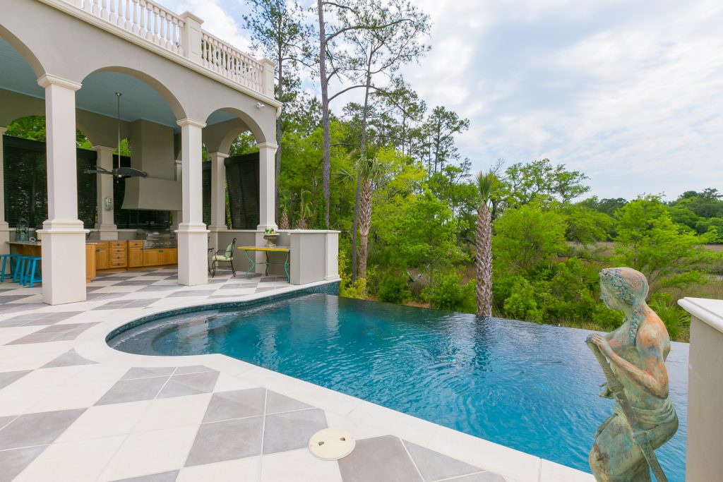 Inground pool with a tile decking