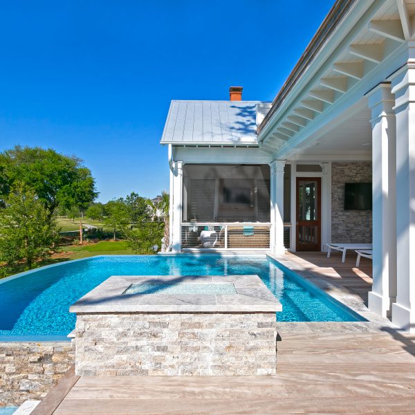 Side view of a backyard infinity pool