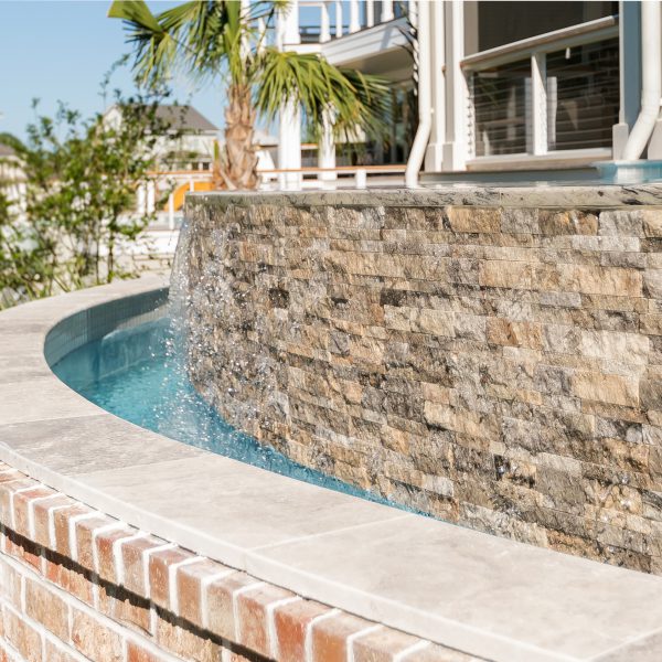 Close up of the water feature in a backyard pool