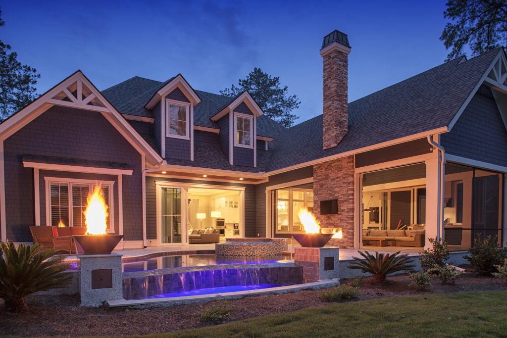 Infinity Pool at Night with Fire Pit Lighting