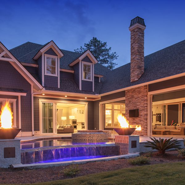 Infinity Pool at Night with Fire Pit Lighting