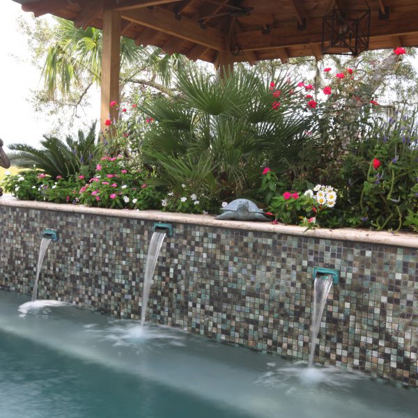 Waterfall attached to backyard pool