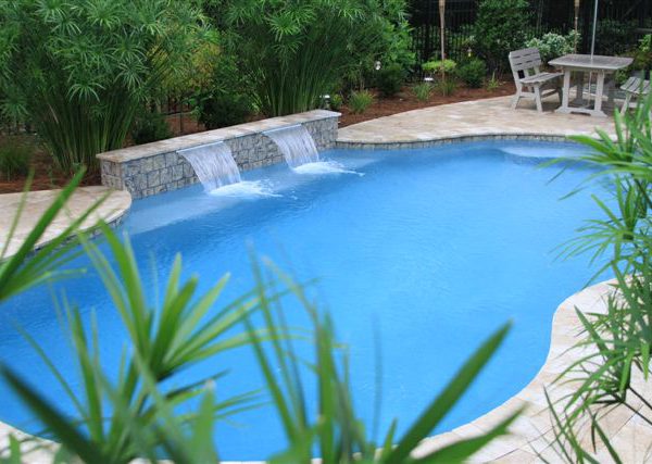 Ariel view of outdoor pool with two waterfalls