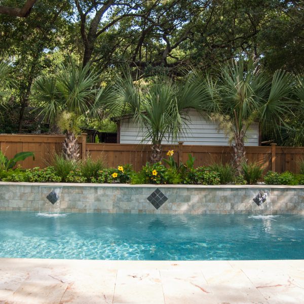 Front view of outdoor pool with two waterfalls