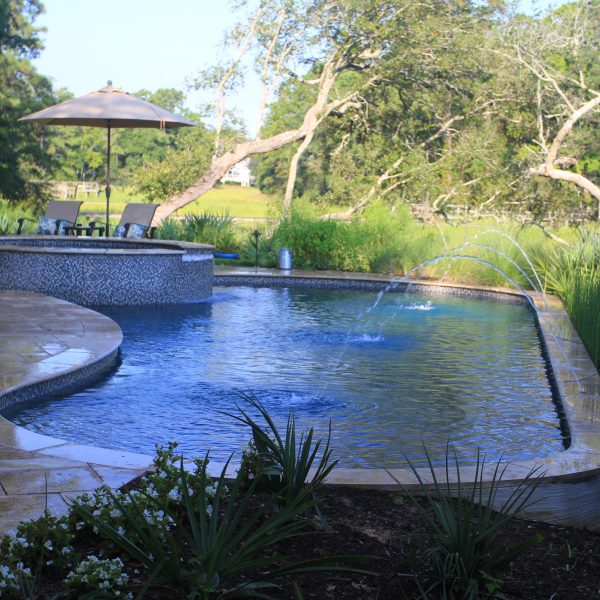 Backyard pool with circle hot tub and water fountains