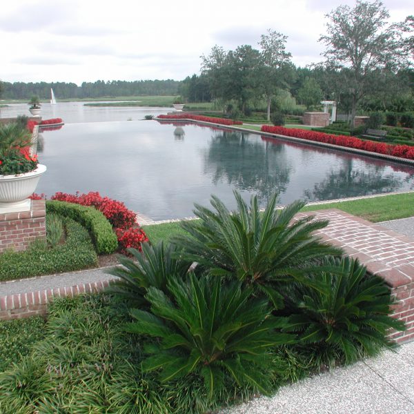 Large outdoor pond with water fountain in the middle