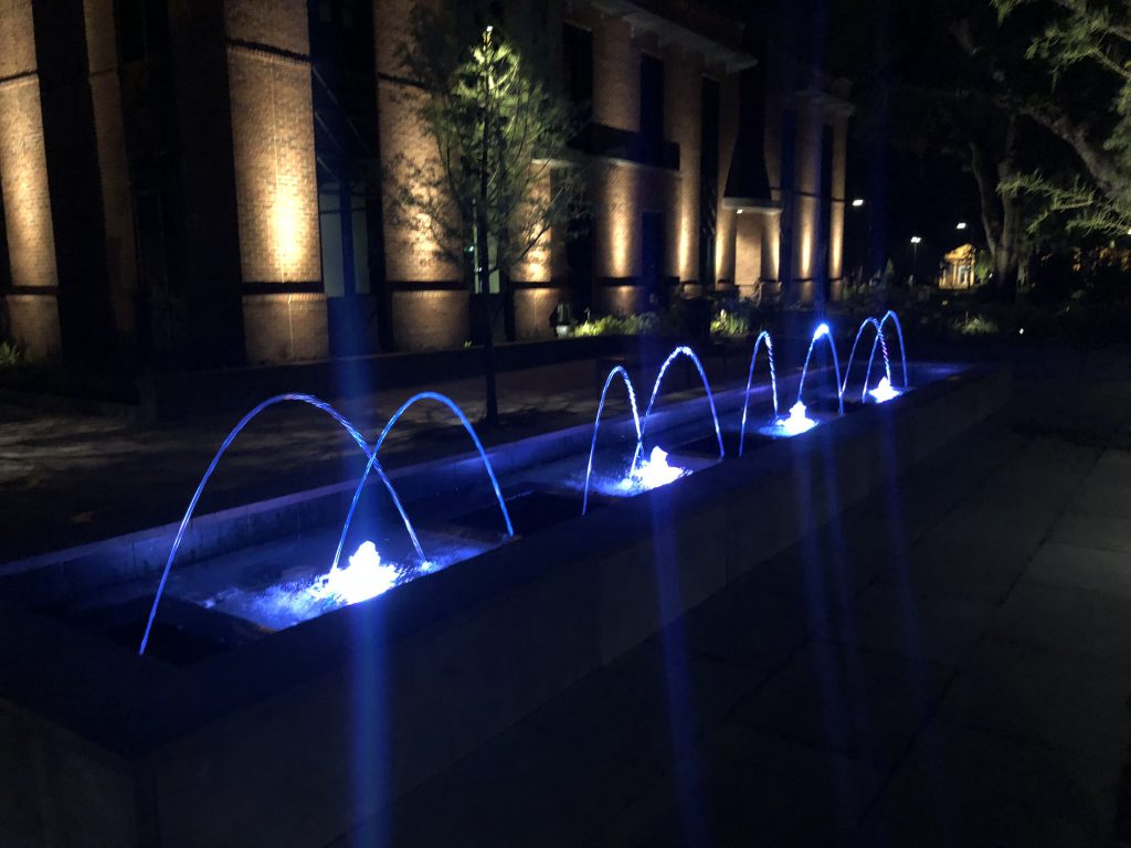 Luxury Water Fountains with Pool Lights at Night