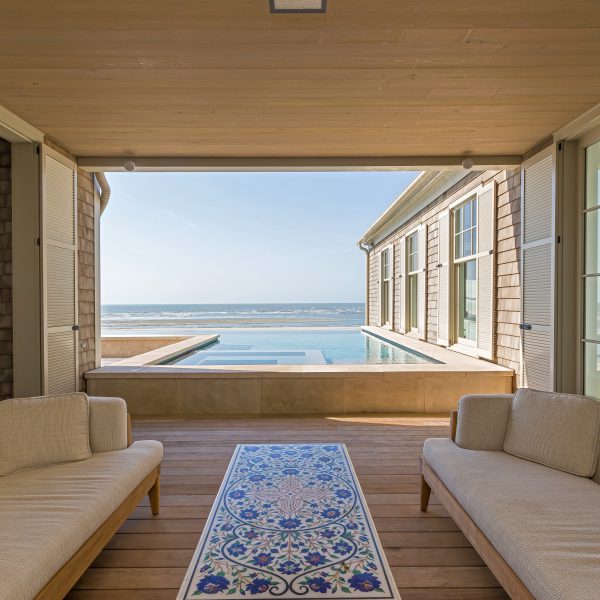 Overlooking an infinity pool by the beach