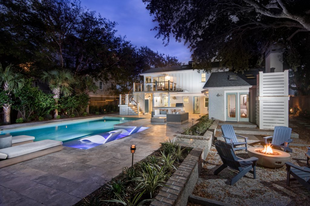 Custom Geometric Pool with Tanning Ledge at Night