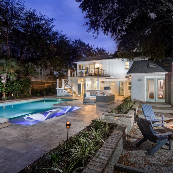 Custom Geometric Pool with Tanning Ledge at Night