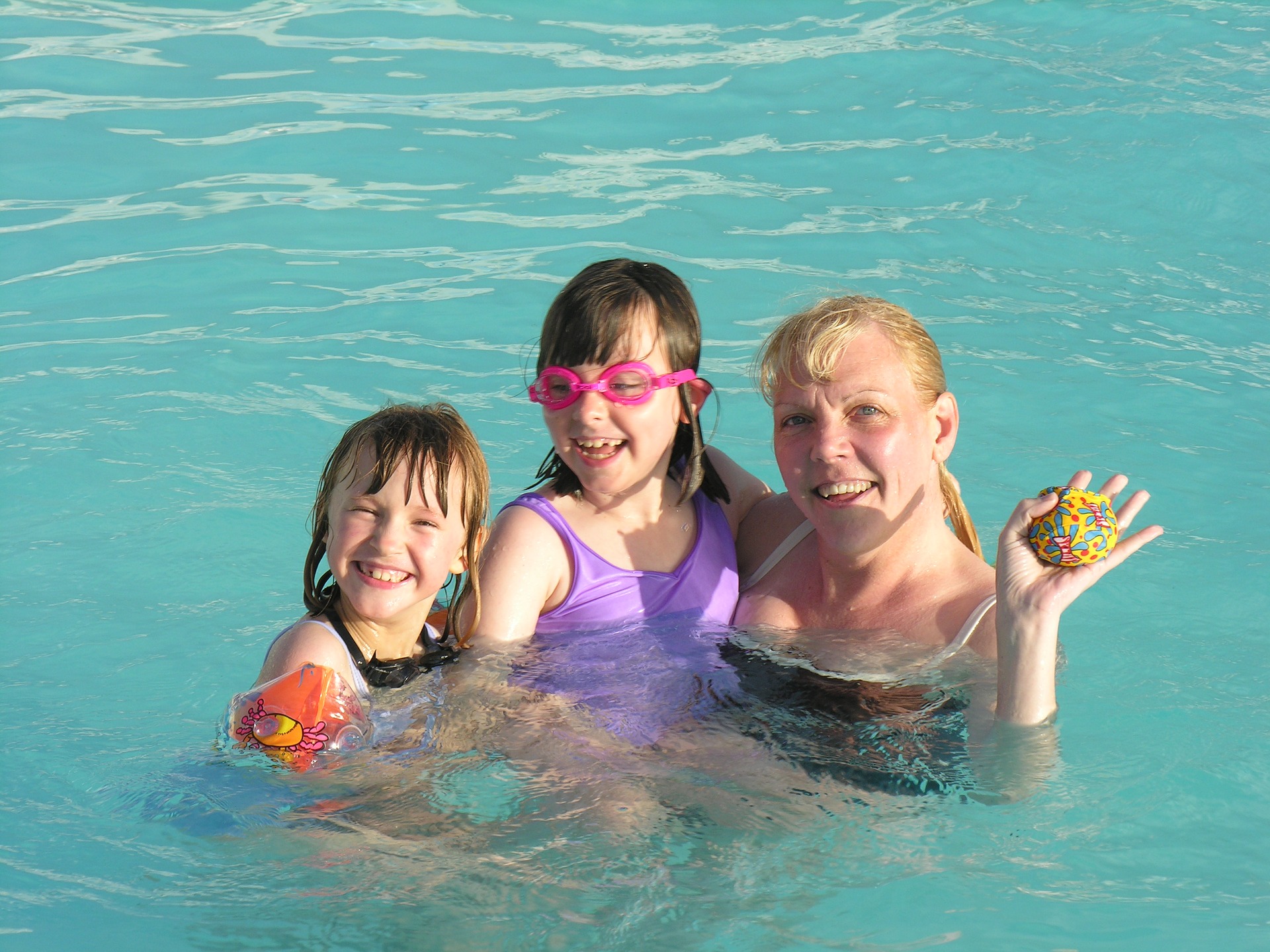 Family in swimming pool