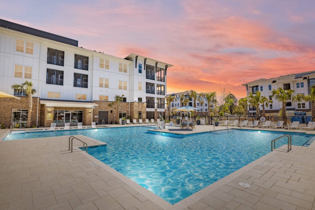 Apartment complex pool at sunset