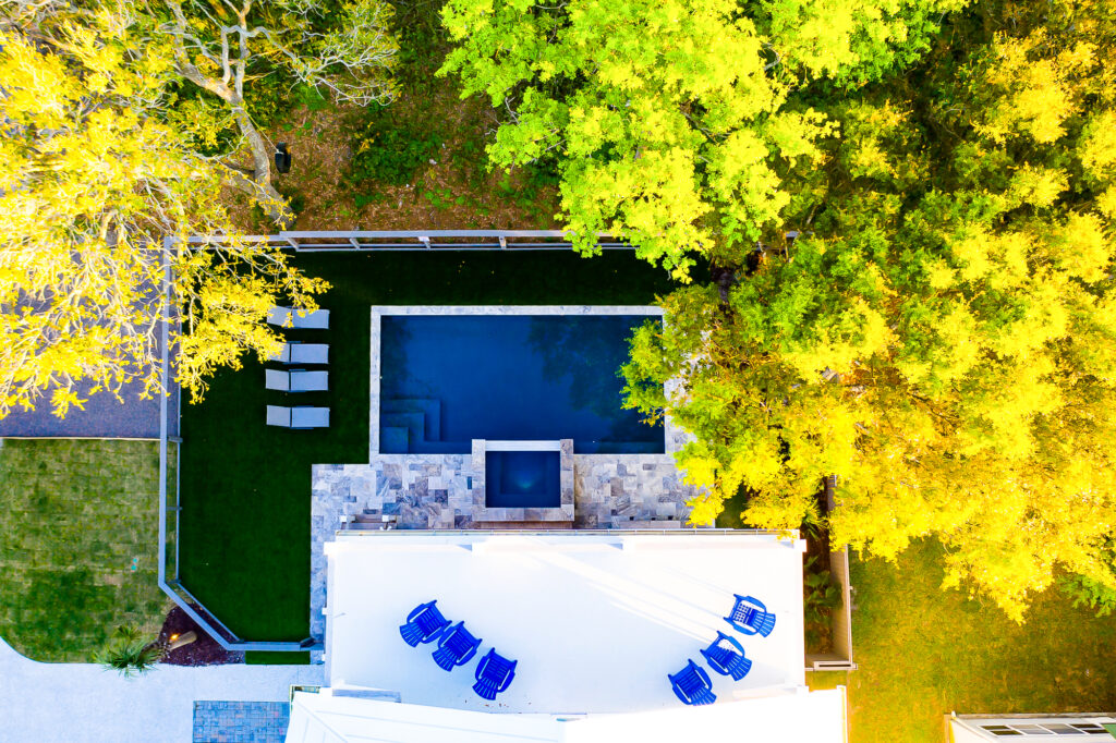 aerial view of home, porch, backyard and pool