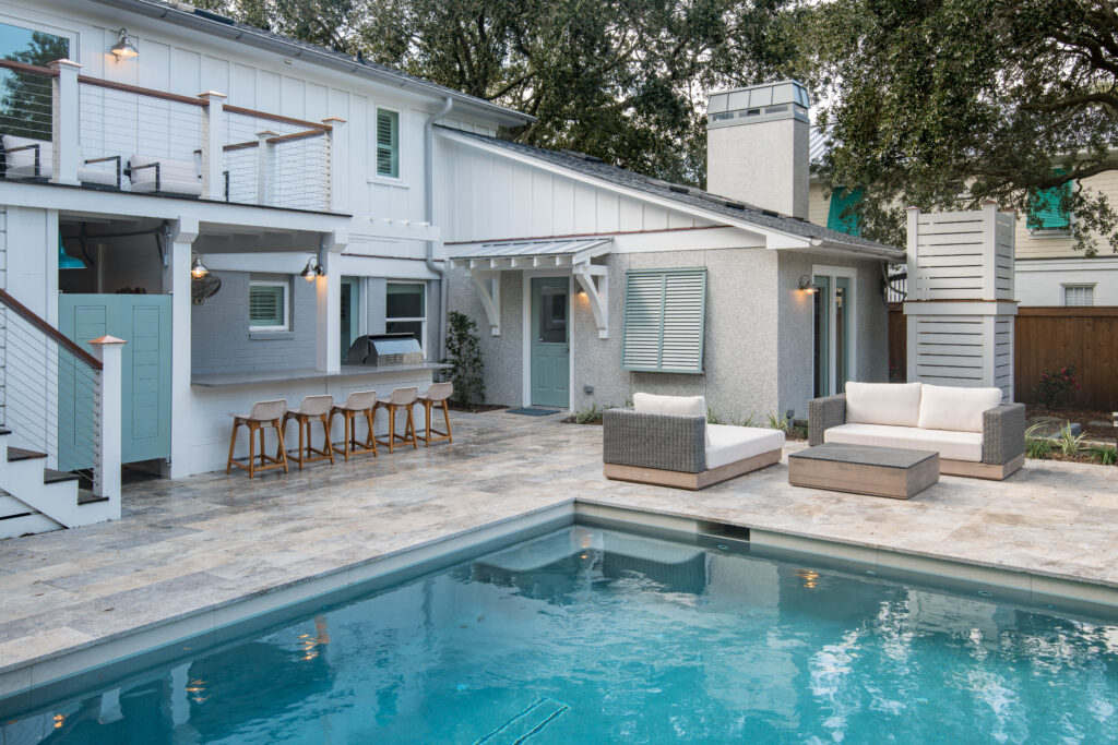 Backyard pool with sitting area and outdoor bar