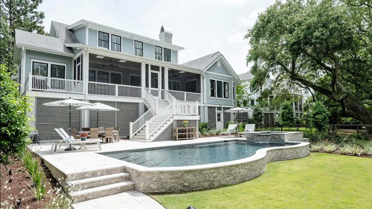 Image of a residential elevated pool overlooking a backyard.