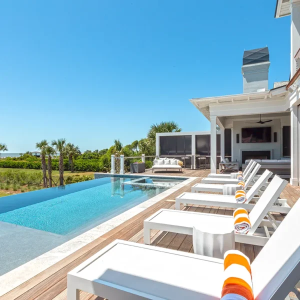 Contemporary pool with loungers and unobstructed ocean view