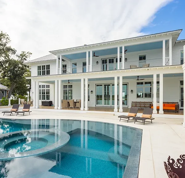 Elegant infinity spa and pool with expansive white patio