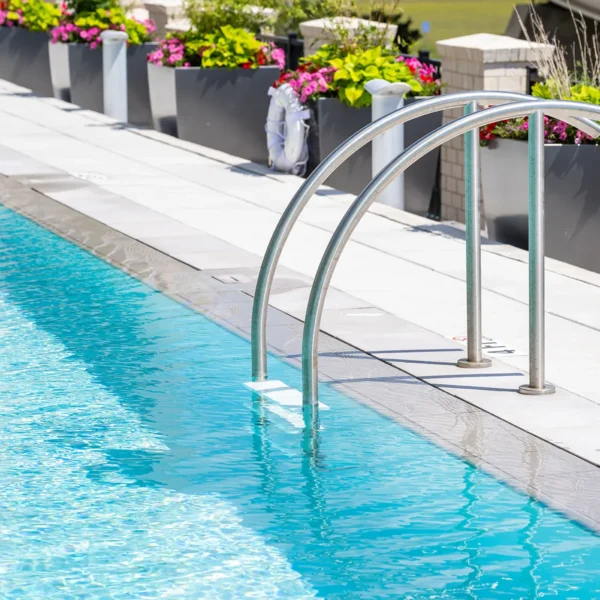 Poolside handrail and flower planters at rooftop pool